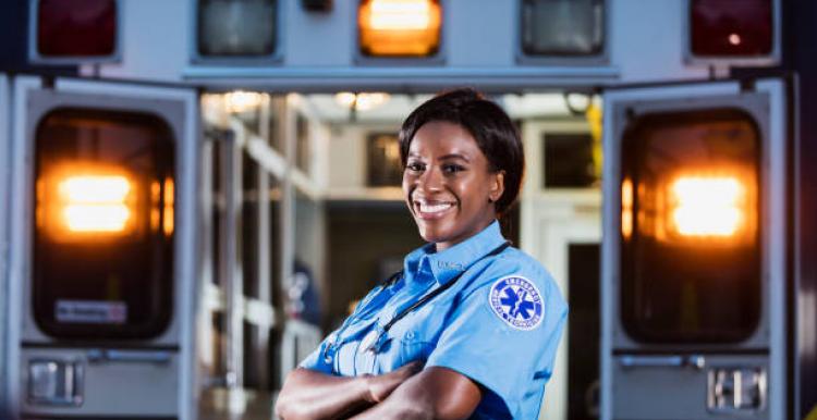 Woman at the back of an ambulance