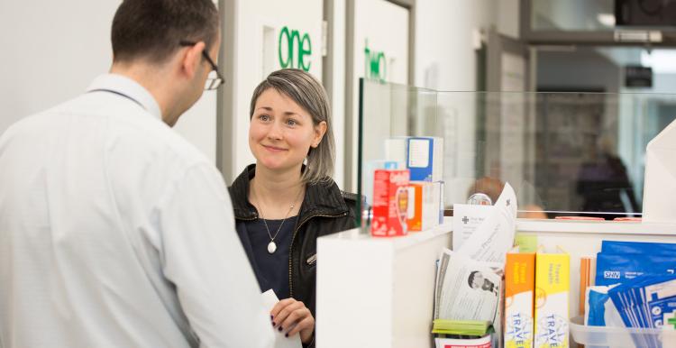 Woman being served in a pharmacy