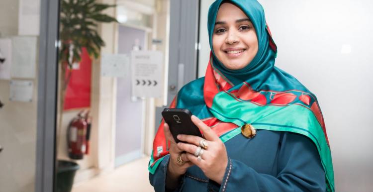 Muslim young women in traditional dress in doctors waiting area