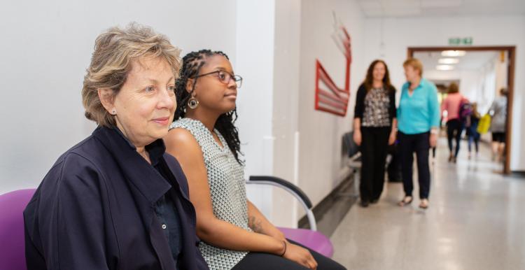 People waiting in a hospital corridor