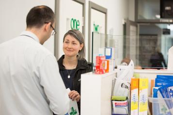 Woman being served in a pharmacy