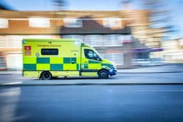 An ambulance speeding down a road