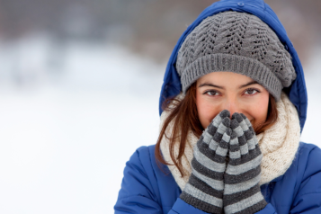 lady wearing winter clothes outside in the cold