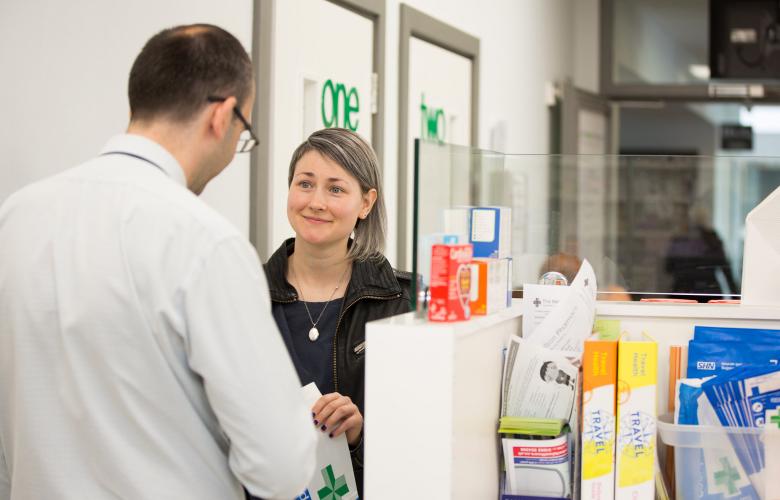 Woman being served in a pharmacy